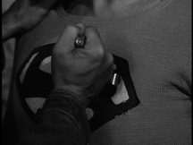 Mack's knife bends as he tries to stab Superman in the chest
