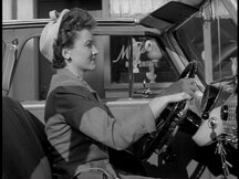 Lois driving her car