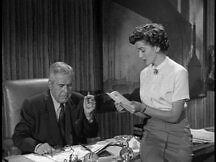 Lois Lane reads the letter from Kathy to Superman aloud to Perry White