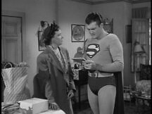 Virginia stands by while Superman reads Kathy's note