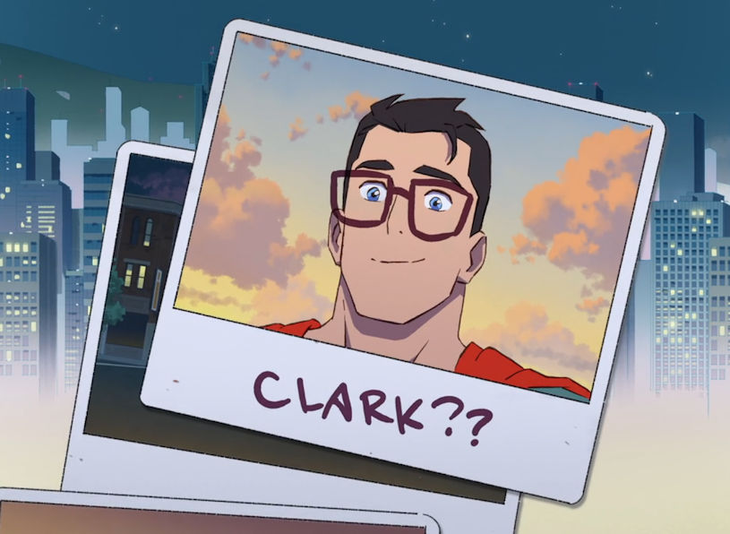 A screenshot from the My Adventures of Superman cartoon showing a photo of Superman's face with glasses doodled on it and the text "Clark??" written underneath it